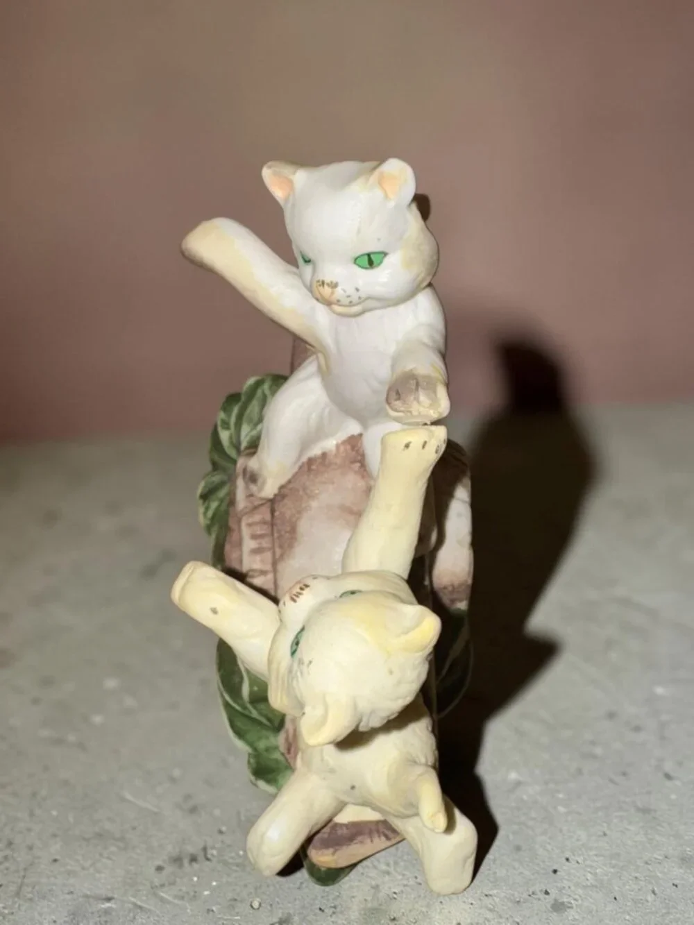 Vintage Ceramic Figurine Of Two Playful Cats On Log With Green Leaves